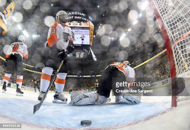 Radko Gudas of the Philadelphia Flyers and Brian Elliott of the Philadelphia Flyers react against the Pittsburgh Penguins in Game One of the Eastern...