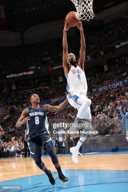 Corey Brewer of the Oklahoma City Thunder drives to the basket during the game against MarShon Brooks of the Memphis Grizzlies on April 11, 2018 at...