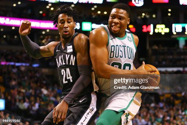 Guerschon Yabusele of the Boston Celtics drives to the basket past Rondae Hollis-Jefferson of the Brooklyn Nets during a game at TD Garden on April...