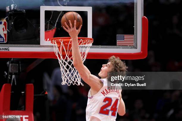 Lauri Markkanen of the Chicago Bulls attempts a shot in the first quarter against the Detroit Pistons at the United Center on April 11, 2018 in...