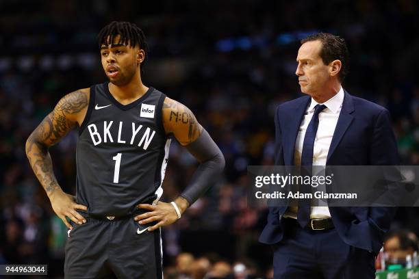 Brooklyn Nets head coach Kenny Atkinson talks to D'Angelo Russell of the Brooklyn Nets during a game against the Boston Celtics at TD Garden on April...