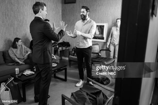 Episode 672 -- Pictured: Host Seth Meyers talks with actor John Krasinski backstage on April 11, 2018 --