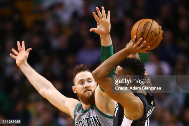 Aron Baynes of the Boston Celtics guards Allen Crabbe of the Brooklyn Nets during a game at TD Garden on April 11, 2018 in Boston, Massachusetts....