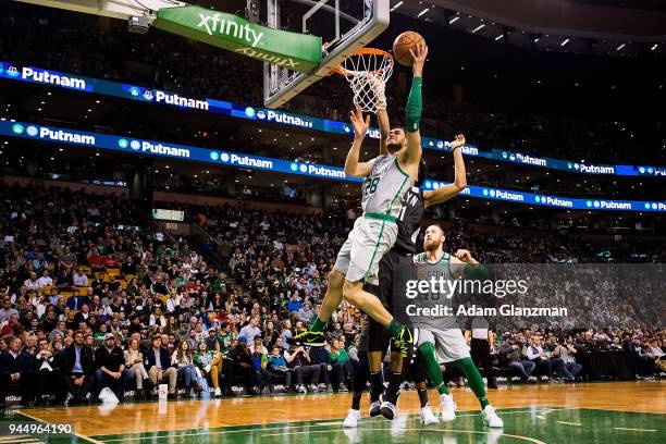 Abdel Nader of the Boston Celtics drives to the basket for a layup past Jarrett Allen of the Brooklyn Nets during a game at TD Garden on April 11,...