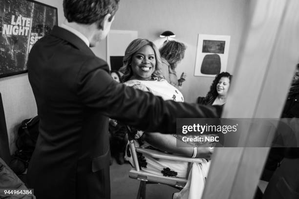 Episode 672 -- Pictured: Host Seth Meyers talks with actress Retta backstage on April 11, 2018 --