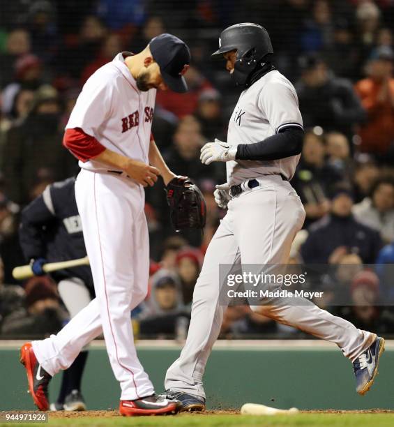 Matt Barnes of the Boston Red Sox reacts as Giancarlo Stanton of the New York Yankees scores a run during the sixth inning at Fenway Park on April...