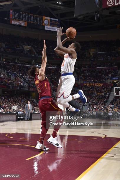 Frank Ntilikina of the New York Knicks shoots the ball against London Perrantes of the Cleveland Cavaliers on April 11, 2018 at Quicken Loans Arena...