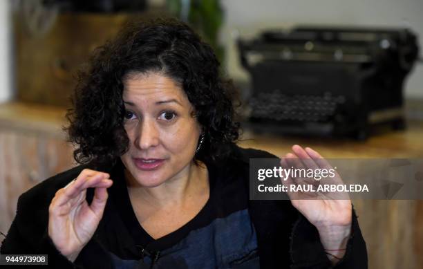 Colombian writer Pilar Quintana speaks during an interview with AFP in Bogota on February 24, 2018. - Only when she feared for her life did Pilar...