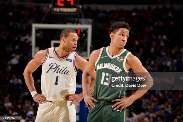 Justin Anderson of the Philadelphia 76ers and Malcolm Brogdon of the Milwaukee Bucks look on during the game between the two teams on April 11, 2018...