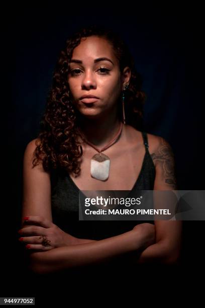 Brazilian activist Buba Aguiar poses for a portrait after an interview with AFP in Rio de Janeiro, Brazil on April 03, 2018. Almost a month after...