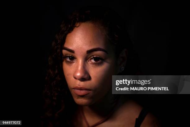 Brazilian activist Buba Aguiar poses for a portrait after an interview with AFP in Rio de Janeiro, Brazil on April 03, 2018. Almost a month after...