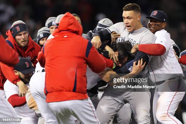 From left, Chris Sale of the Boston Red Sox, Aaron Judge of the New York Yankees and Rafael Devers work to separate a fight involving Joe Kelly of...