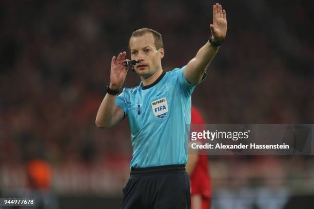 Referee William Collum reacts during the UEFA Champions League Quarter Final Second Leg match between Bayern Muenchen and Sevilla FC at Allianz Arena...