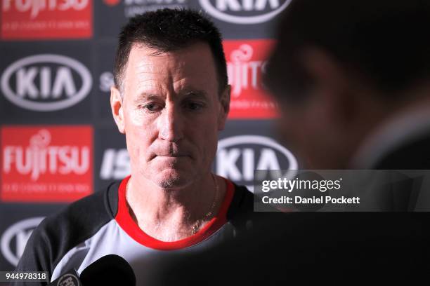 Bombers head coach John Worsfold talks to the media during an Essendon Bombers AFL training session at the Essendon Football Club on April 12, 2018...