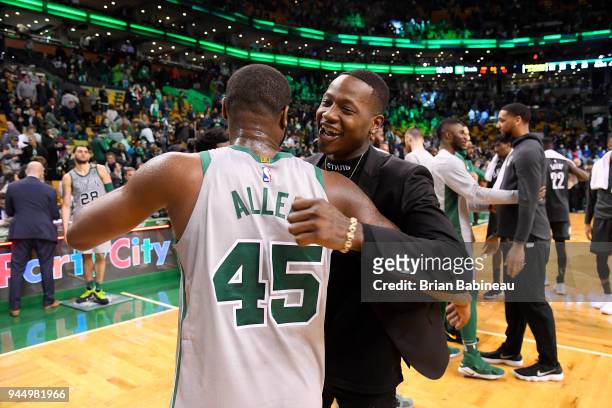 Kadeem Allen and Terry Rozier of the Boston Celtics hug after the game against the Brooklyn Nets on April 11, 2018 at the TD Garden in Boston,...