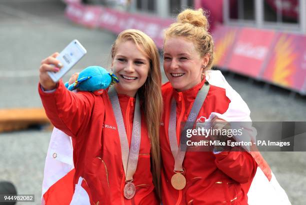 England's Evie Richards and Annie Last take a selfie with their medals after the Women's Cross-country at the Nerang Mountain Bike Trails during day...