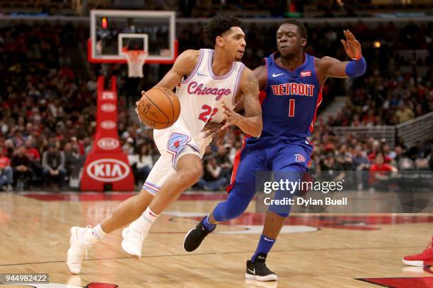 Cameron Payne of the Chicago Bulls dribbles the wball bg Reggie Jackson of the Detroit Pistons in the third quarter at the United Center on April 11,...