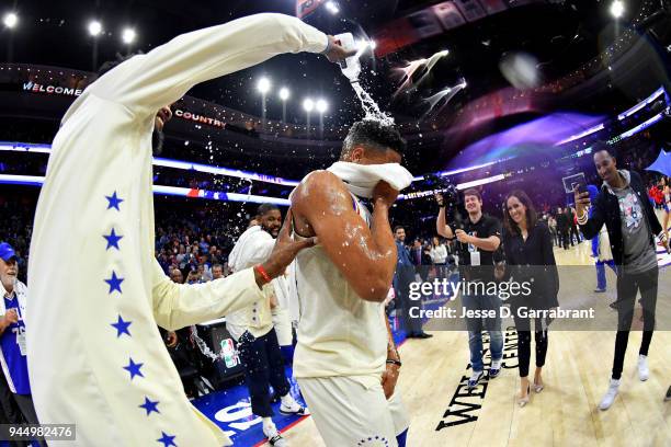 Robert Covington cover Markelle Fultz of the Philadelphia 76ers in water after his first career triple double against the Milwaukee Bucks on April...