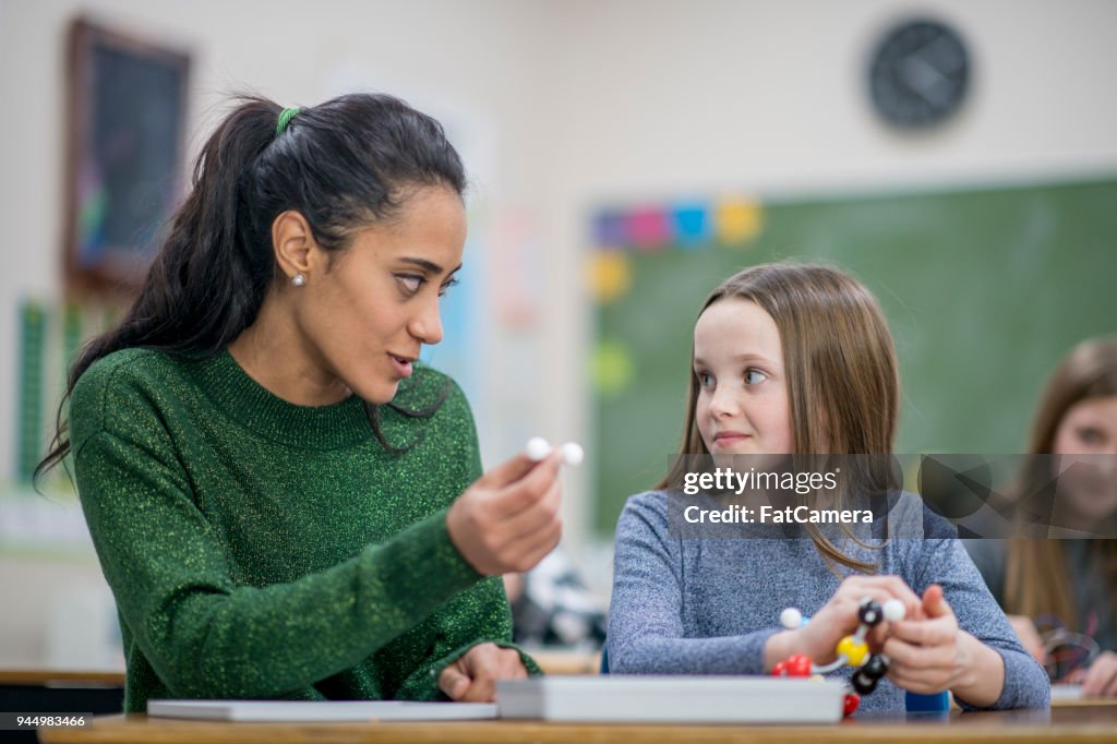 Teacher Lending A Hand