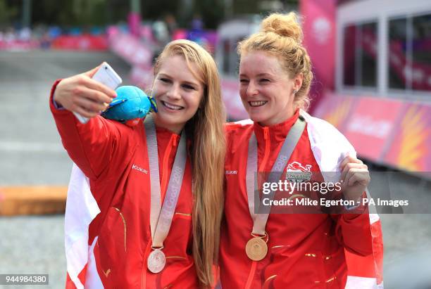 England's Evie Richards and Annie Last take a selfie with their medals after the Women's Cross-country at the Nerang Mountain Bike Trails during day...