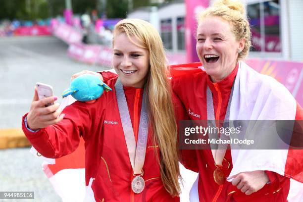 Silver medalist Evie Richards of England and gold medalist Annie Last of England pose for a selfie following the medal ceremony for the Women's...