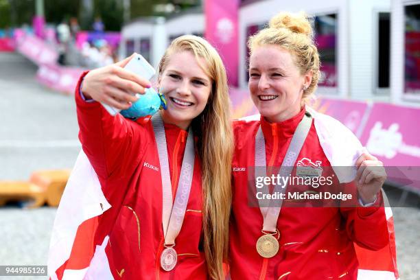 Silver medalist Evie Richards of England and gold medalist Annie Last of England pose for a selfie following the medal ceremony for the Women's...
