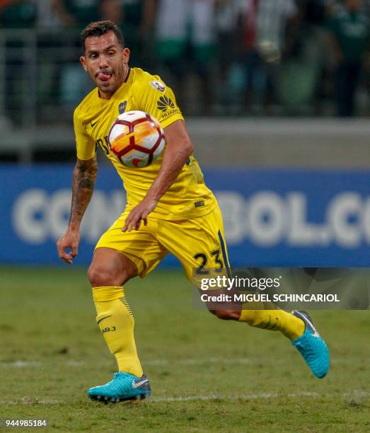 Carlos Tevez of Argentina's Boca Juniors eyes the ball, during their 2018 Copa Libertadores football match against Brazilian Palmeiras, at Allianz...