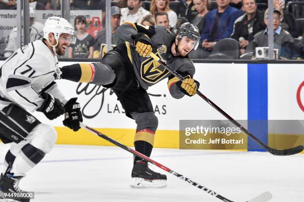 Shea Theodore of the Vegas Golden Knights shoots the puck while Torrey Mitchell of the Los Angeles Kings defends in Game One of the Western...