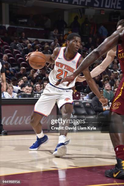Damyean Dotson of the New York Knicks handles the ball against the Cleveland Cavaliers on April 11, 2018 at Quicken Loans Arena in Cleveland, Ohio....