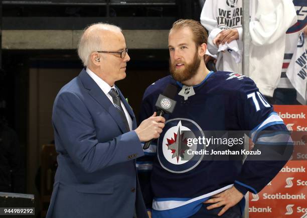 Joe Morrow of the Winnipeg Jets answers questions from Sportsnet reporter Scott Oake following a 3-2 victory over the Minnesota Wild in Game One of...