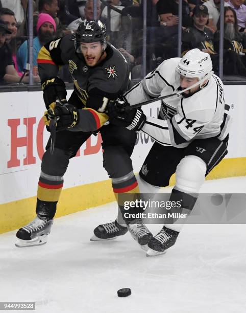 Jon Merrill of the Vegas Golden Knights and Nate Thompson of the Los Angeles Kings go after a loose puck in the first period of Game One of the...