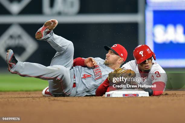 Aaron Altherr of the Philadelphia Phillies gets picked off at second base by Cliff Pennington of the Cincinnati Reds in the 10th inning at Citizens...