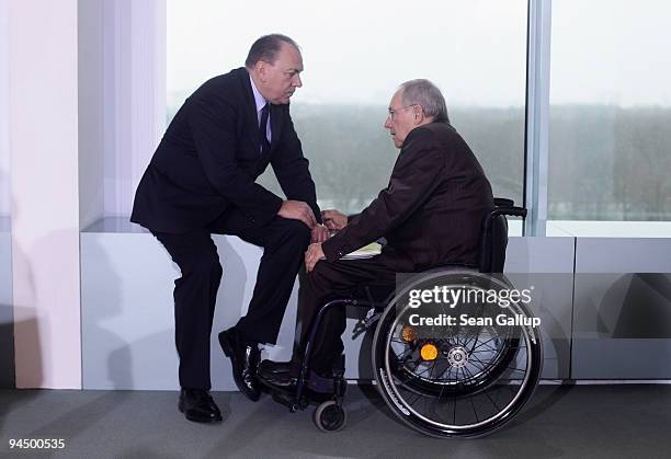 Axel Weber , President of the German Bundesbank, chats with Finance Minister Wolfgang Schaeuble as they arrive for the weekly German government...