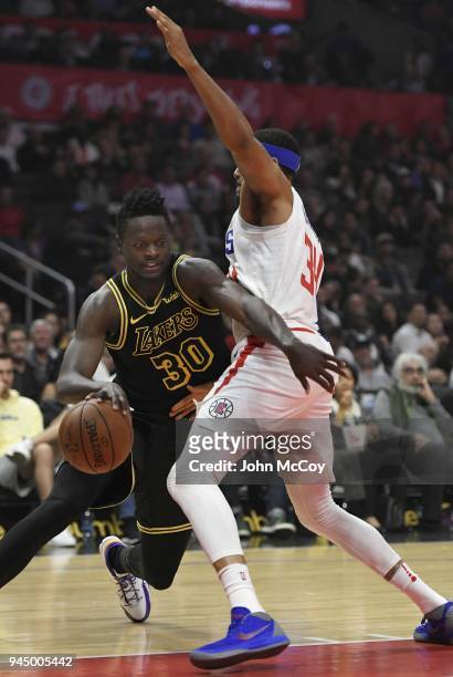 Julius Randle of the Los Angeles Lakers tries to get around Tobias Harris of the LA Clippers in the first hafl at Staples Center on April 11, 2018 in...