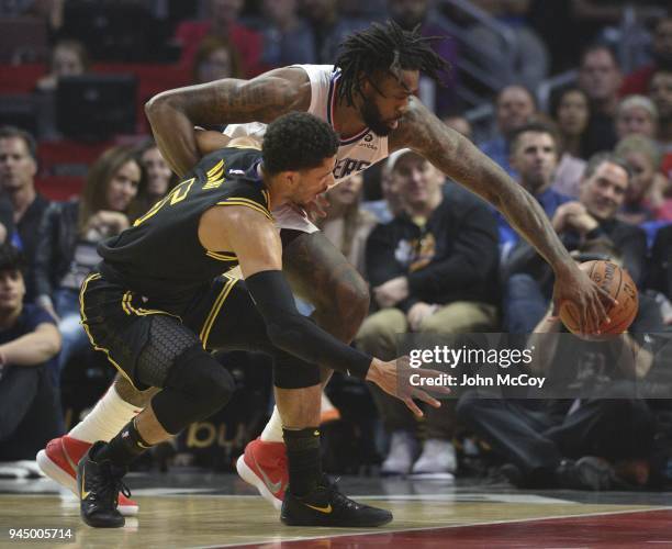 Josh Hart of the Los Angeles Lakers and DeAndre Jordan of the LA Clippers battle for the ball in the first half at Staples Center on April 11, 2018...