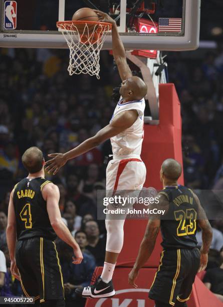 Williams of the LA Clippers gets past Alex Caruso of the Los Angeles Lakers and Gary Payton II of the Los Angeles Lakers for a dunk in the first half...