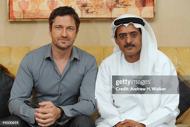 Actor Gerard Butler and DIFF Chairman Abdulhamid Juma during a portrait session on day seven of the 6th Annual Dubai International Film Festival held...