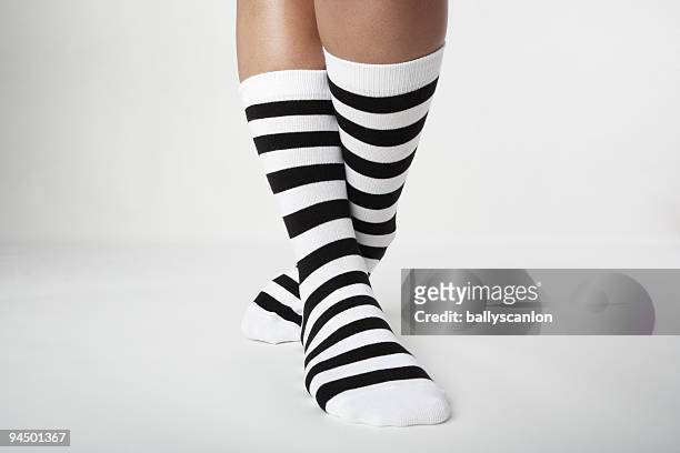 woman wearing striped socks. - crazy socks stock pictures, royalty-free photos & images