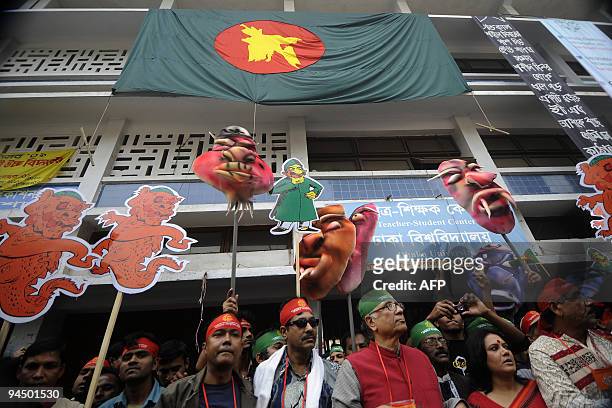 Bangladeshi people hold colourful masks during a rally held to mark the country's 38th Victory Day in Dhaka on December 16, 2009. Bangladesh won...