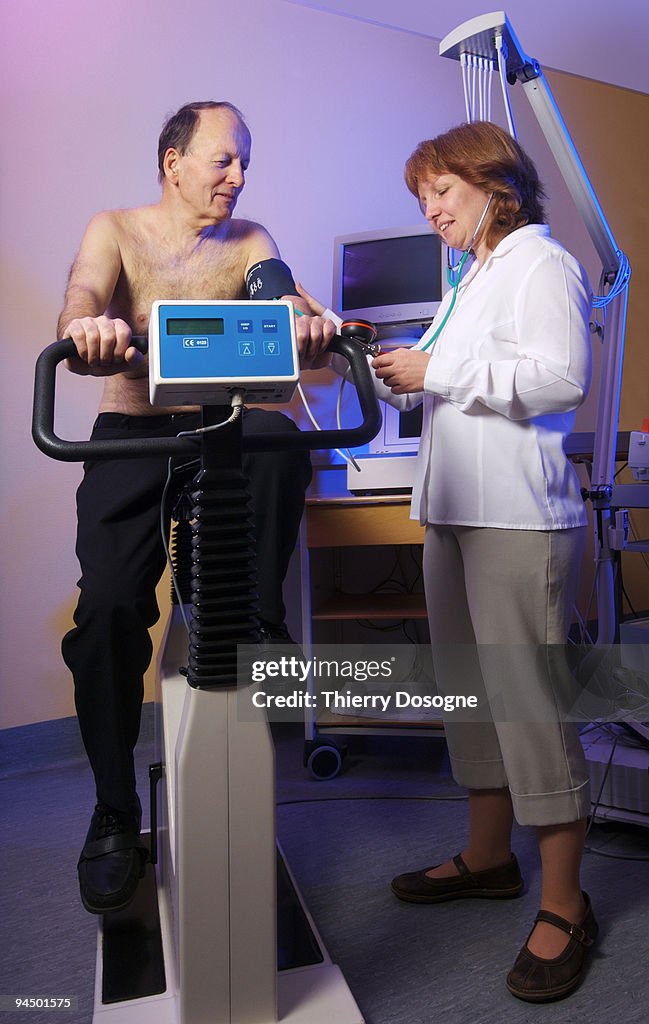 Senior patient receiving cardiology test.