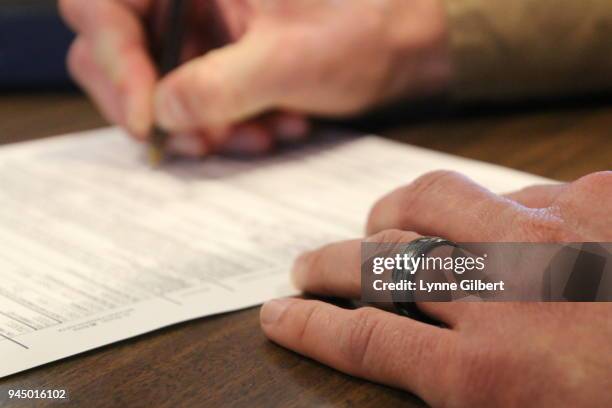 a best man signs the marriage license after the wedding ceremony - marriage certificate stock pictures, royalty-free photos & images