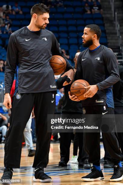 Nikola Vucevic of the Orlando Magic and D.J. Augustin of the Orlando Magic talk before the game against the Washington Wizards on April 11 2018 at...