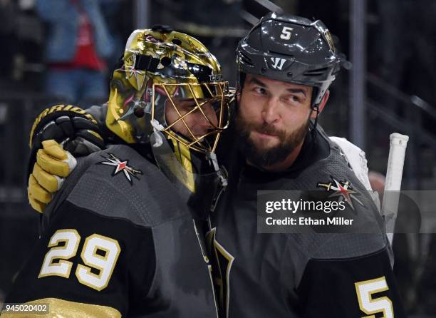 Marc-Andre Fleury and Deryk Engelland of the Vegas Golden Knights celebrate after the team's 1-0 win over the Los Angeles Kings in Game One of the...