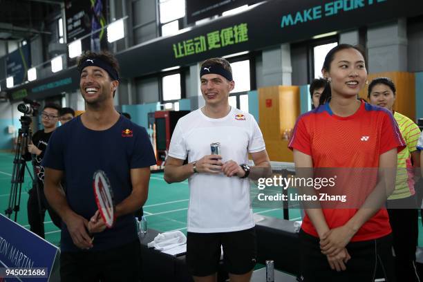 Max Verstappen of Netherlands and Red Bull Racing and Daniel Ricciardo of Australia and Red Bull Racing play badminton with badminton world champion...