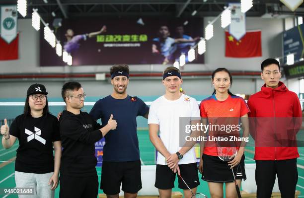 Max Verstappen of Netherlands and Red Bull Racing and Daniel Ricciardo of Australia and Red Bull Racing play badminton with badminton world champion...