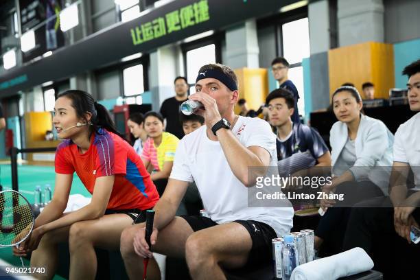 Max Verstappen of Netherlands and Red Bull Racing plays badminton with badminton world champion Wang Yihan during previews ahead of the Formula One...