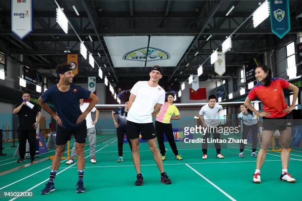 Max Verstappen of Netherlands and Red Bull Racing and Daniel Ricciardo of Australia and Red Bull Racing play badminton with badminton world champion...