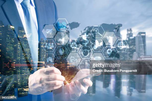 double exposure businessman hand working with digital tablet computer. business plan and technology networking concept - banker doppelbelichtung stock-fotos und bilder
