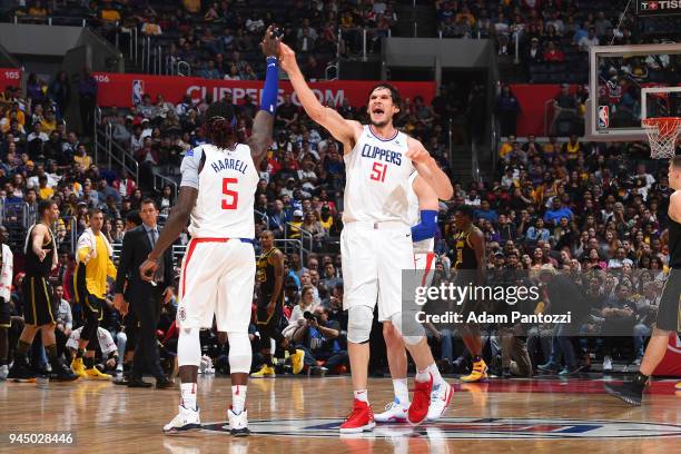 Montrezl Harrell and Boban Marjanovic of the LA Clippers react to a play during the game against the Los Angeles Lakers on April 11, 2018 at STAPLES...