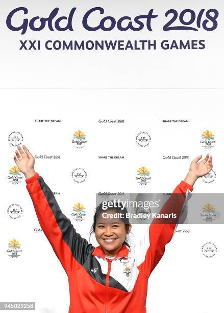 Martina Lindsay Veloso of Singapore celebrates winning a gold medal in the Women's 50m Rifle Prone event during Shooting on day eight of the Gold...